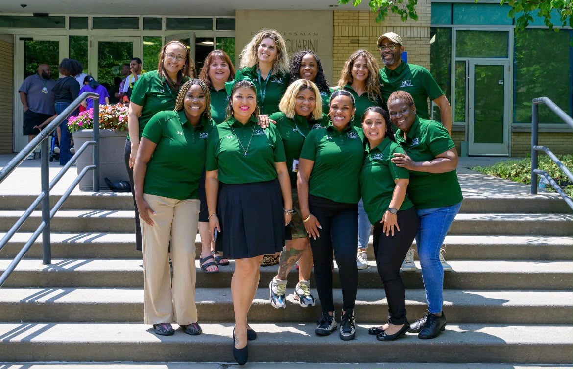 Cohort 13 group photograph at the New Jersey City University Guarini building during Summer Institute I